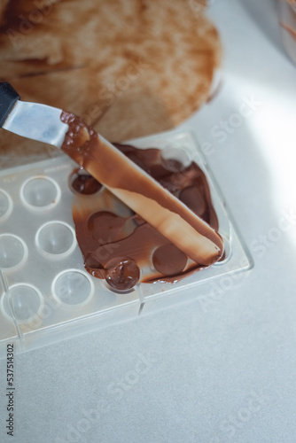 Woman the chef prepares chocolate sweets. Homemade delicious sugar dessert. Healthy food 