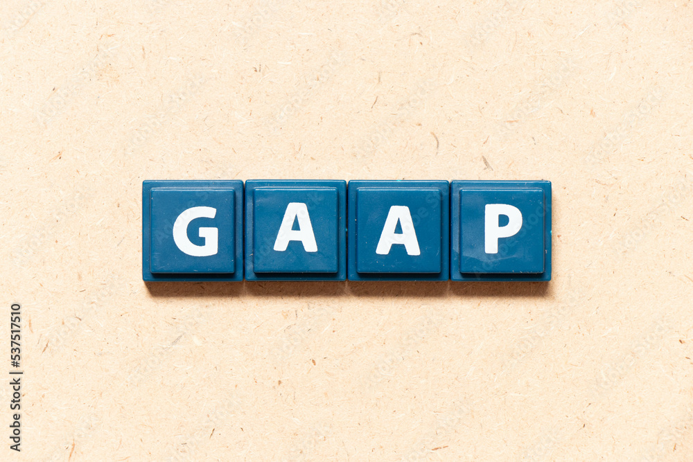 Tile letter in english word GAAP (Abbreviation of Generally accepted accounting principles) on wood background Tile letter in english word GAAP (Abbreviation of Generally accepted accounting principles) on wood background