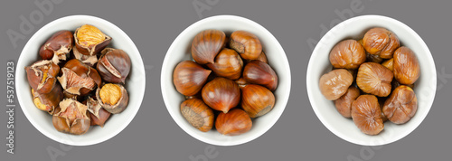 Fotografie Unshelled, roasted and boiled chestnuts, marrons in white bowls over gray