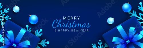 Christmas banner. Horizontal blue xmas background design with snowflake, gift box and blue ball elements. Vector illustration