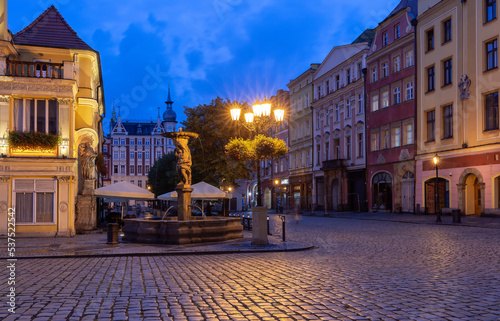 Swidnica. Old medieval market square and colorful houses at dawn.
