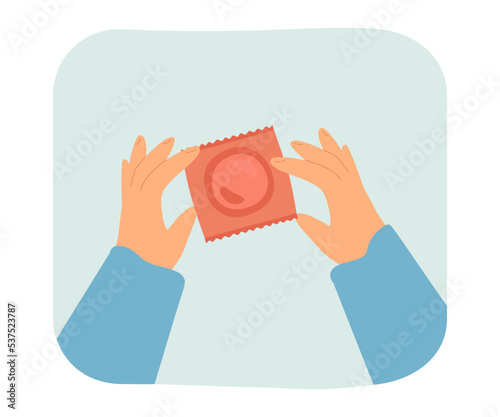 Hands holding condom in package for birth control. Person using contraceptives flat vector illustration. Contraception, sexual education concept for banner, website design or landing web page