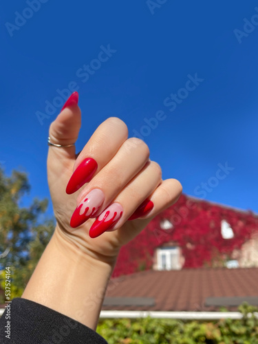 Close up woman's hand with Halloween gothic vampire manicure . Details for Halloween party concept