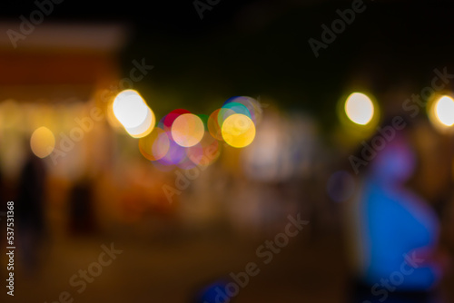 Texture blur background for design. Out of focus evening street views of the city roads. Evening light in the dark.
