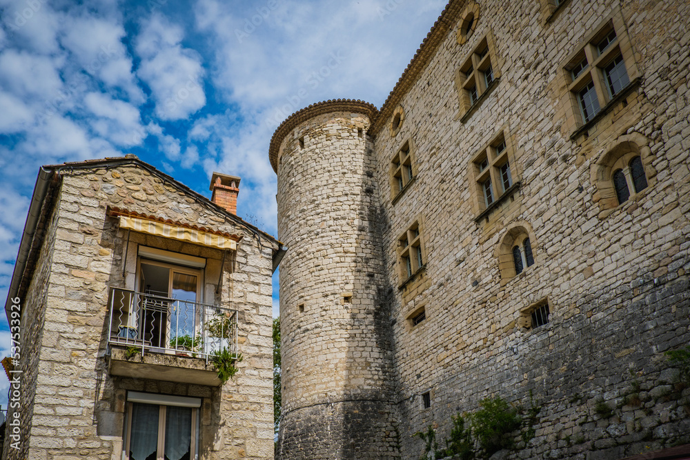 View on the Vogüé medieval castle  with its stone facade and angle watchtowers in the south of France (Ardeche)