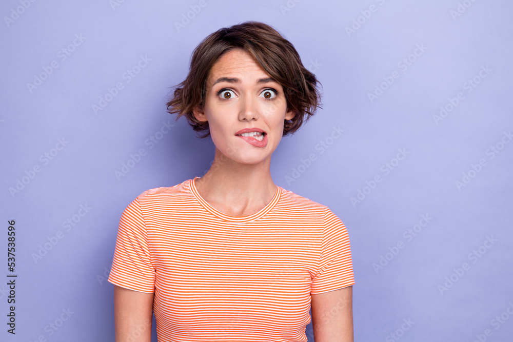 Closeup photo of young pretty nice cute gorgeous woman bob hair nervous stressed worker deadline manager bite lips isolated on purple color background Closeup photo of young pretty nice cute gorgeous woman bob hair nervous stressed worker deadline manager bite lips isolated on purple color background