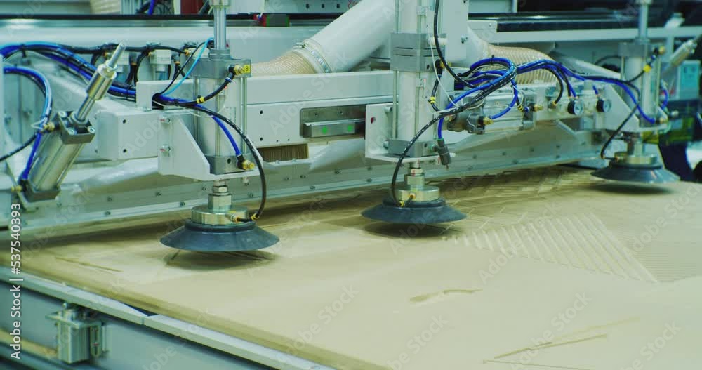 furniture production.modern cnc machine processes wood panel.close-up. furniture production.modern cnc machine processes wood panel.close-up.