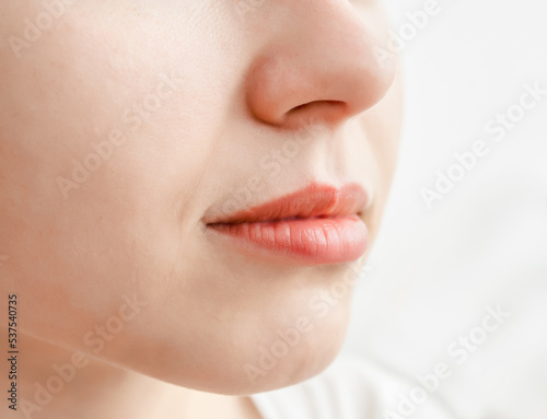 Natural lips of a young girl. Beautiful mouth shape