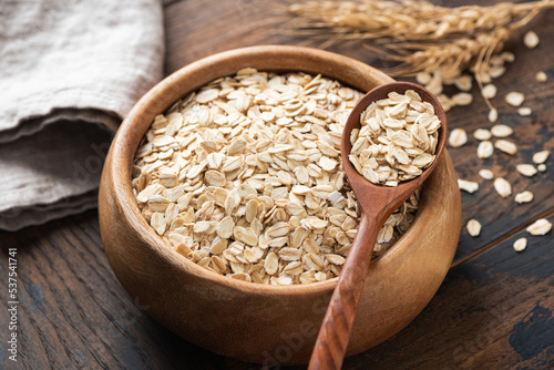 Rolled oats in wooden bowl