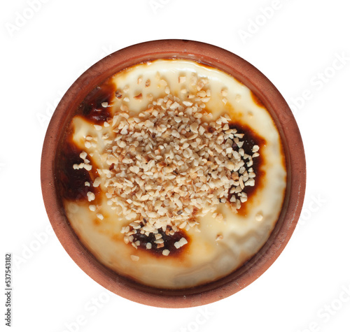 Top view of delicious baked rice pudding with chopped hazelnuts, traditional milky dessert known as in Turkish 