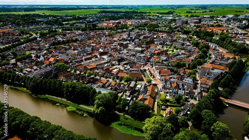 Aerial shot of the beautiful Dokkum city surrounded by a river during daytime photo
