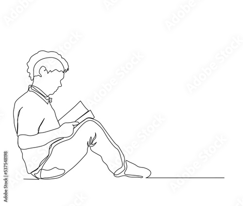 Fototapeta Naklejka Na Ścianę i Meble -  Continuous one line drawing of student reading a book. A young boy sit and reading book single line art drawing vector illustration.
