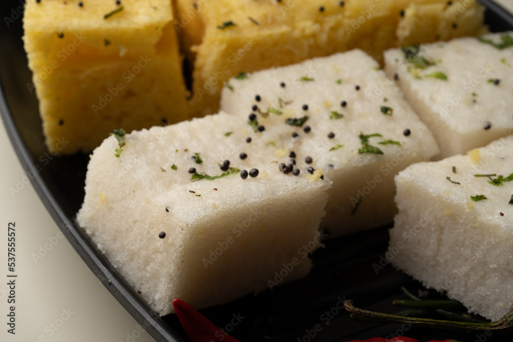 Indian popular Gujrati breakfast dish White Dhokla, Khatta , Rice and Urad Dal Khaman. Also known as Instant Rava Dhokla AND yellow dhokla or besan gram flour. served with ketchup 
