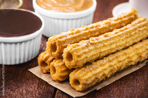 churros, fried sweet with granulated sugar, filled with dulce de leche or creamy chocolate