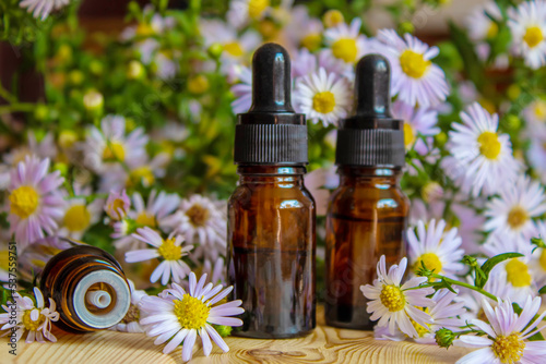 flower oil in glass bottles.homeopathy.selective focus