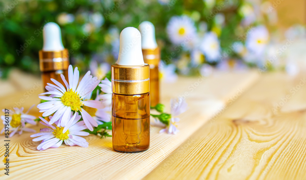 flower oil in glass bottles.homeopathy.selective focus flower oil in glass bottles.homeopathy.selective focus