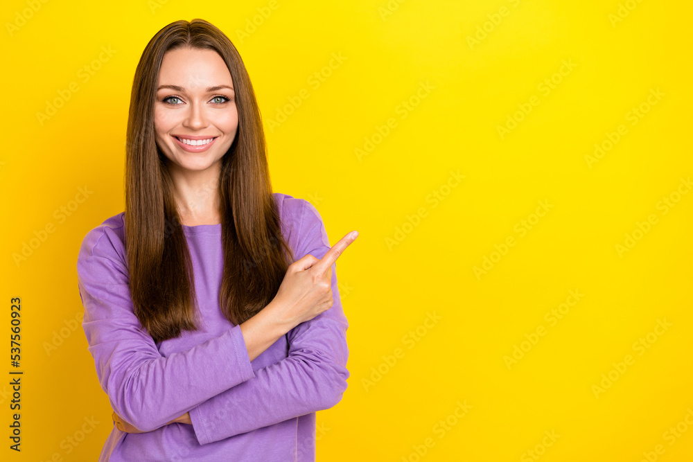 Photo of young pretty business lady wear stylish purple pullover confident successful rich person finger point empty space isolated on yellow color background Photo of young pretty business lady wear stylish purple pullover confident successful rich person finger point empty space isolated on yellow color background