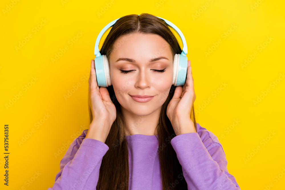 Close up photo of pretty adorable calm lady wear trendy clothes like new modern purchase isolated on yellow color background Close up photo of pretty adorable calm lady wear trendy clothes like new modern purchase isolated on yellow color background