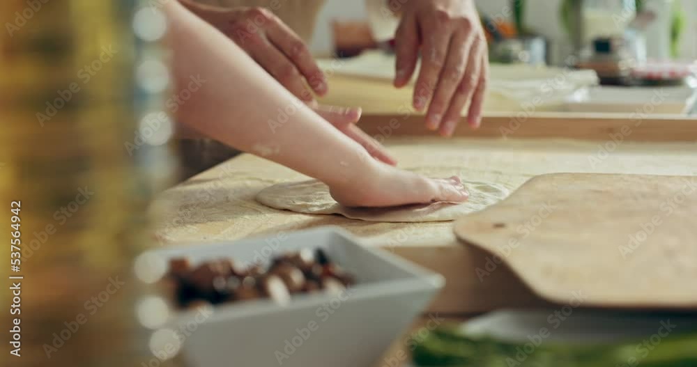 Close up shot small kid's hands kneading shaping pizza dough with father. Happy kid spending time with dad in kitchen cooking baking preparing dinner surprise at weekeends. Close up shot small kid's hands kneading shaping pizza dough with father. Happy kid spending time with dad in kitchen cooking baking preparing dinner surprise at weekeends.