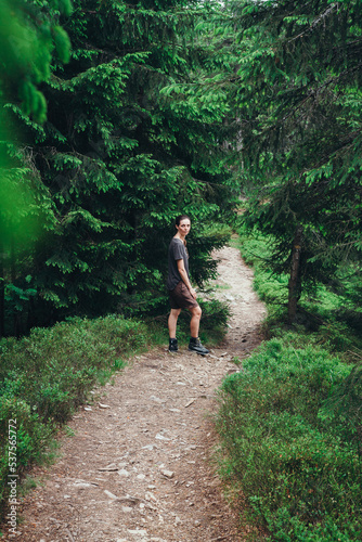 hiking in the mountains. hiker in the forest. The girl travels along the mountain paths. Carpathian Mountains