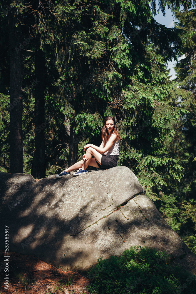 hiking in the mountains. hiker in the forest. The girl travels along the mountain paths. Carpathian Mountains