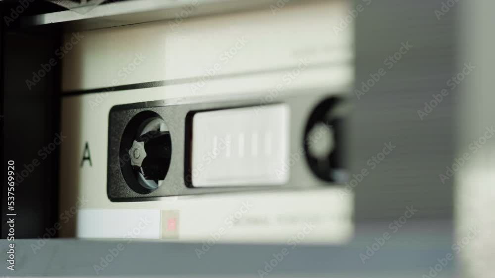 Retro radio tape recorder, audio cassette playing close-up. Listening to music, recording studio old radio boombox player, searching channel, volume. Retro radio tape recorder, audio cassette playing close-up. Listening to music, recording studio old radio boombox player, searching channel, volume.