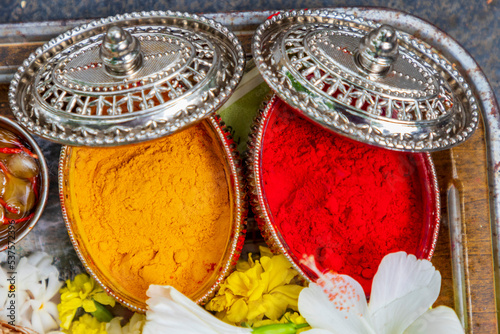 Flower and coconut offerings for Hindu religious ceremony or holy festivals - pasupu kumkuma photo