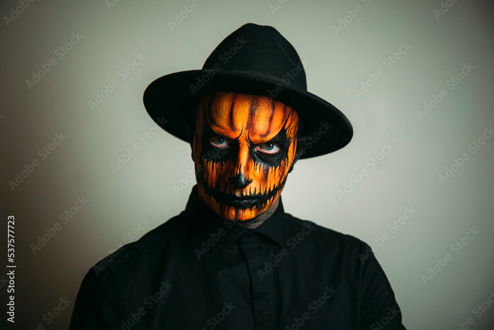 halloween witch with a pumpkin. Pumpkin face. Halloween photo. Male. halloween witch with a pumpkin. Pumpkin face. Halloween photo. Male.