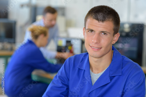 portrait of young male engineer wearing blue jacket