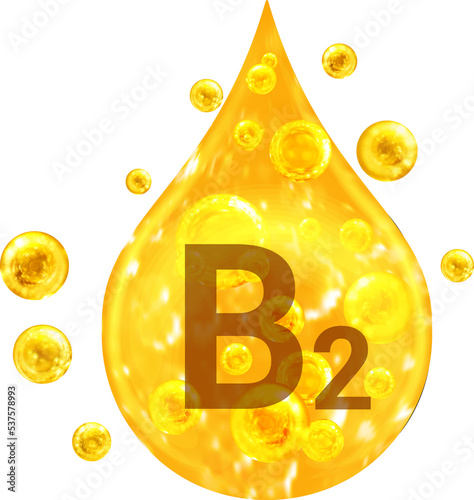 Drop with golden liquid and bubbles. Vitamin B2. photo