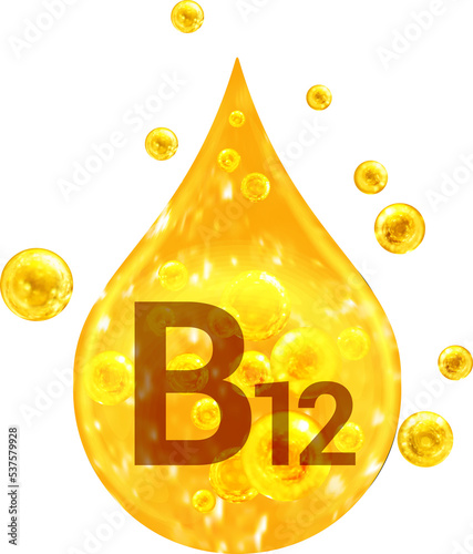 Drop with golden liquid and bubbles. Vitamin B12 photo