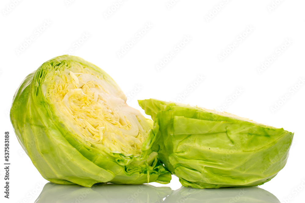 Fototapeta premium Two halves of fresh white cabbage, macro, isolated on white background.