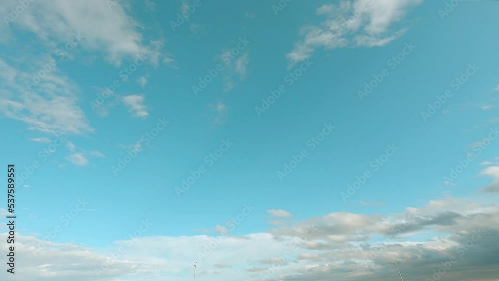 blue sky with clouds, nature 4k time lapse background. the natural landscape of romantic clouds with copy space in middle of the screen. 4k b-roll footage joy n peaceful environment blue sky with clouds, nature 4k time lapse background. the natural landscape of romantic clouds with copy space in middle of the screen. 4k b-roll footage joy n peaceful environment