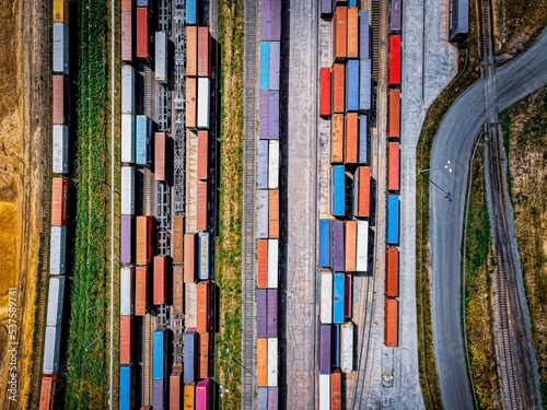 Canvas-taulu Top view of colorful freight trains on the railway station