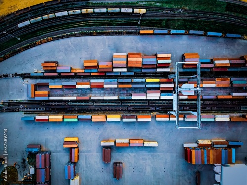 Top view of colorful freight trains on the railway station photo