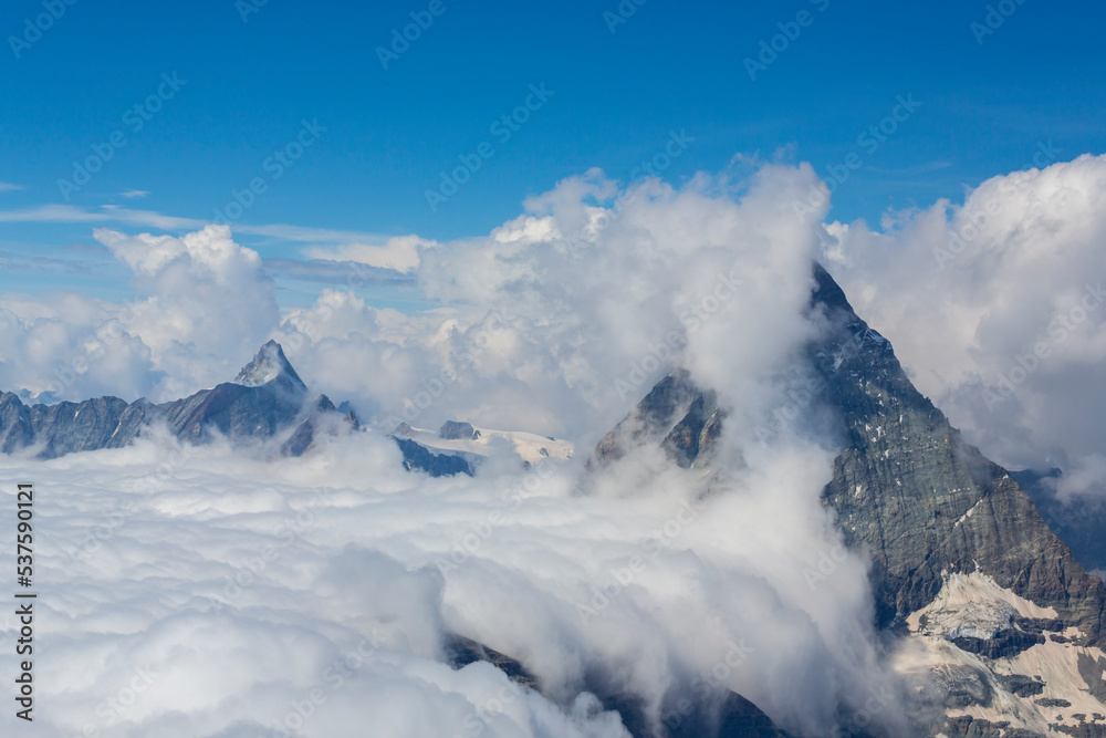 Beautiful alpine scenery in the Swiss Alps in winter, with dramatic cloudscape