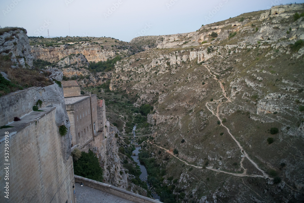 old stone houses and churches on the ravine slopes in the historic ...