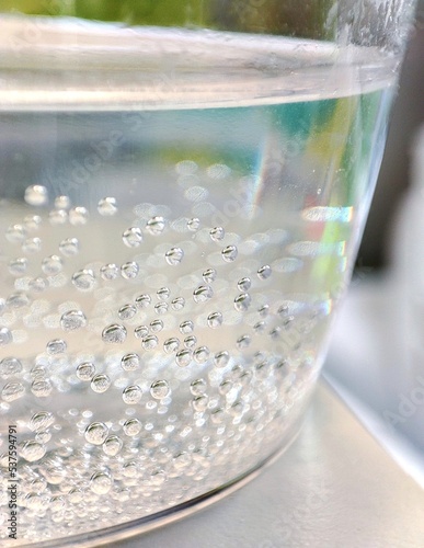 close-up of a drink with bubbles in a transparent glass