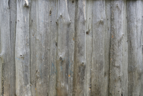 texture. Wooden boards. Wooden fence made of gray unpainted boards.