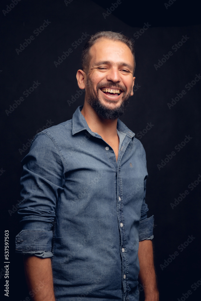 White man smiling, in studio, gray hair