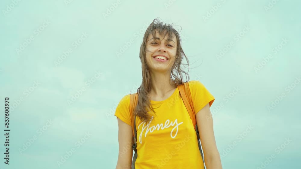portrait of freedom laughing woman enjoying sea beach getaway vacation, feeling good and happy. girl wearing yellow shirt outdoors on sea background portrait of freedom laughing woman enjoying sea beach getaway vacation, feeling good and happy. girl wearing yellow shirt outdoors on sea background