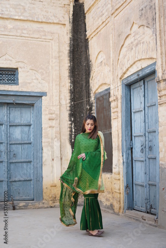girl dancing in punjabi suit