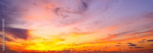 Beautiful sky with bright sunset (sunrise) and clouds. Wide photo.