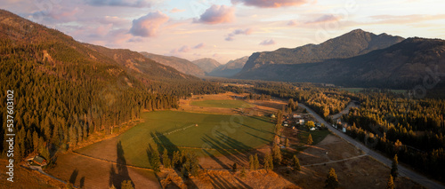 Aerial Panoramic View of the Historic Methow Valley in Eastern Washington State. Farm and ranch land lead to the North Cascade Mountains in this stunning landscape photographed on an autumnal morning.