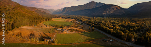 Aerial Panoramic View of the Historic Methow Valley in Eastern Washington State. Farm and ranch land lead to the North Cascade Mountains in this stunning landscape photographed on an autumnal morning. photo