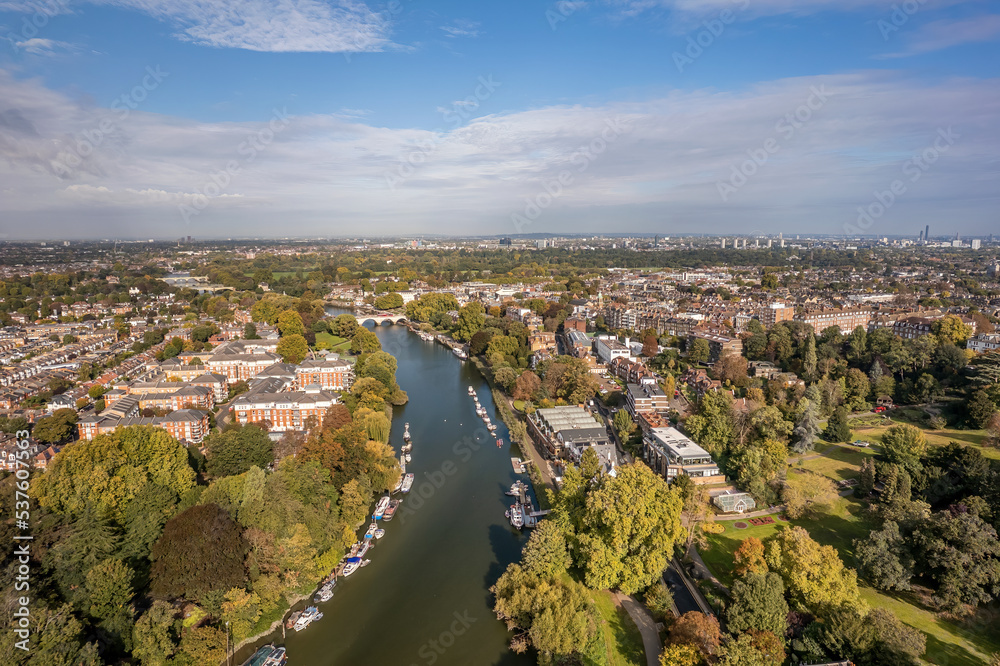 The aerial view of Thames river runs through Richmond town centre on the east bank with its neighbouring district of East Twickenham to the west, London. The aerial view of Thames river runs through Richmond town centre on the east bank with its neighbouring district of East Twickenham to the west, London.