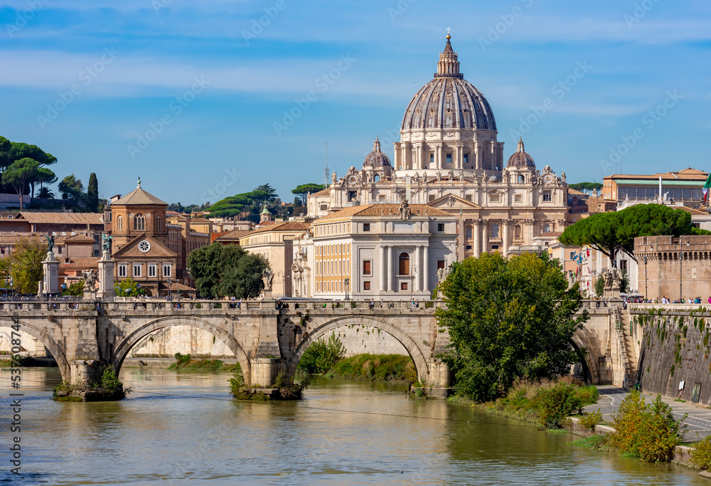 St Peter's basilica in Vatican and St. Angel bridge over Tiber river in Rome, Italy