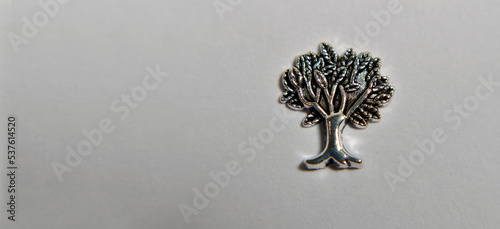 Metalica metal tree ornament on white background photo