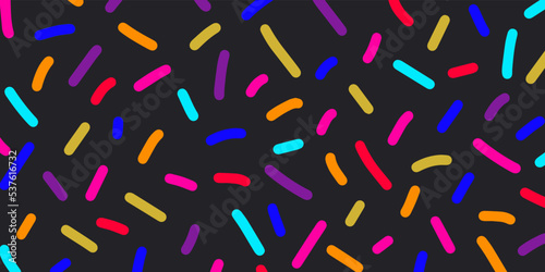 Bright neon colored confetti on black background. Cute abstract horizontal backdrop. Multi colored decorative sprinkles. Pop art style textures. Vector design layout for banners presentations, flyers