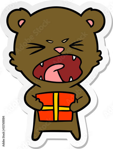 sticker of a angry cartoon bear with present